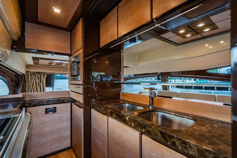 Slide: The Image of Luxurious kitchen interior of 2011 Azimut 70 Fly yacht with modern amenities and sleek design. - 33