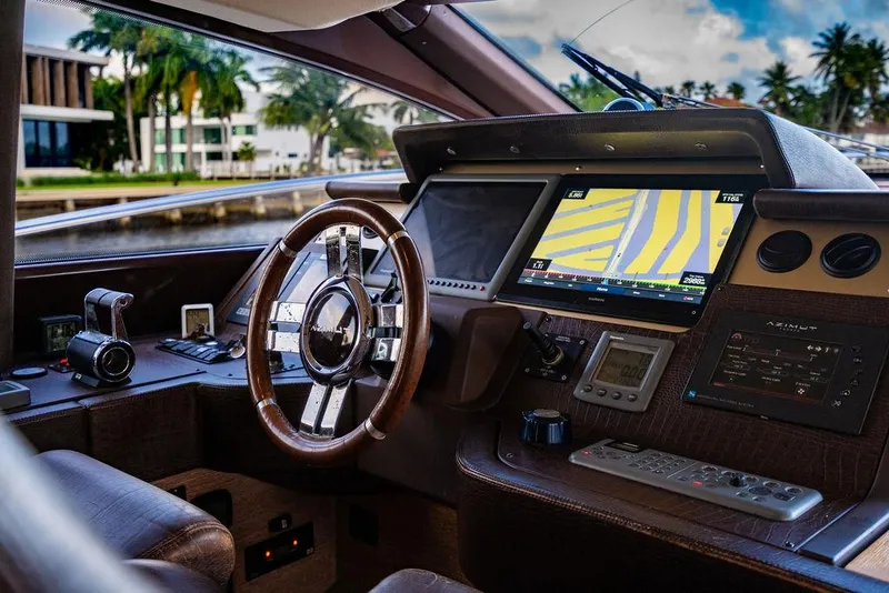 Slide: The Image of Cockpit of 2011 Azimut 70 Fly yacht with navigation system and steering wheel. - 41