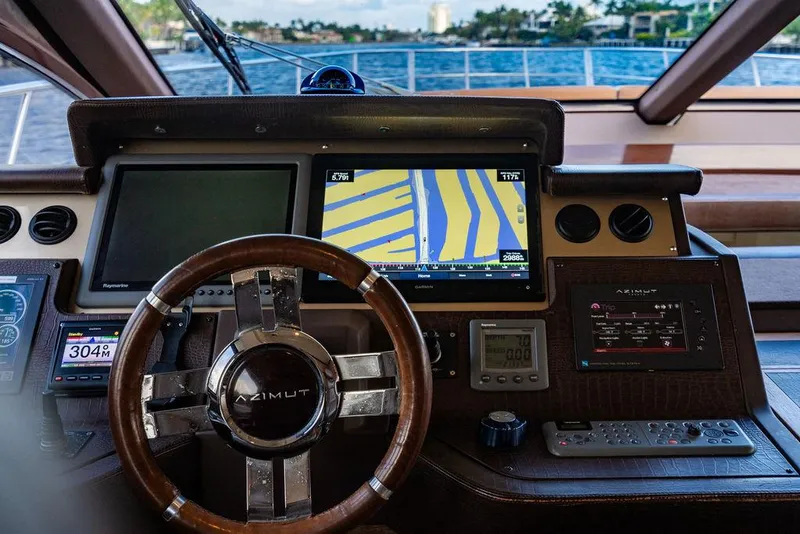 Slide: The Image of Cockpit of 2011 Azimut 70 Fly yacht with navigation screens and steering wheel. - 42