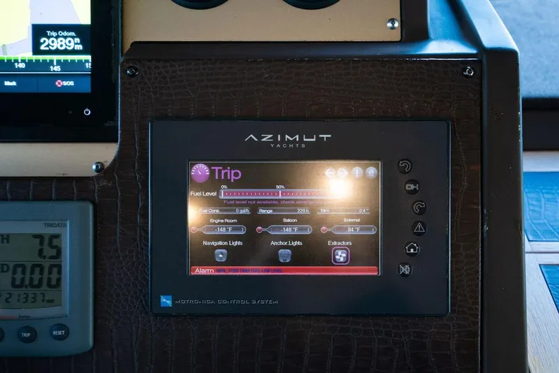 Slide: The Image of Control panel of 2011 Azimut 70 Fly yacht displaying trip information and settings. - 44