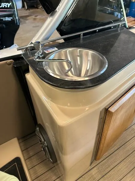 Slide: The Image of 2023 Starcraft SX 23 Q DC boat with a sleek onboard sink and countertop. - 8