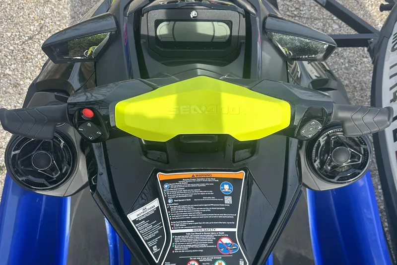 Slide: The Image of 2021 Sea-Doo Wake Pro 230 handlebars and controls, featuring vibrant yellow accents. - 14