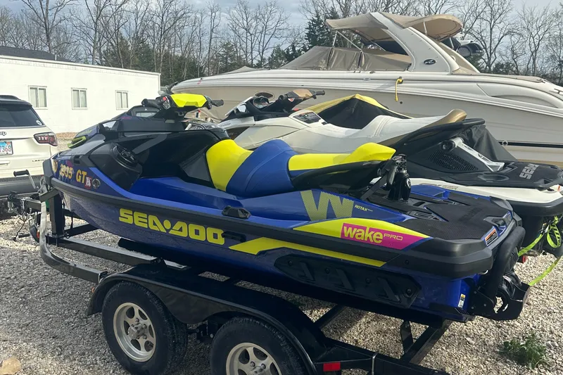 Slide: The Image of 2021 Sea-Doo Wake Pro 230 jet ski on trailer, parked outdoors. - 15