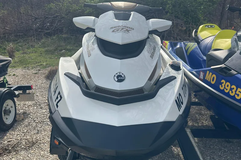 Slide: The Image of 2021 Sea-Doo Wake Pro 230 jet ski parked on gravel, front view. - 19