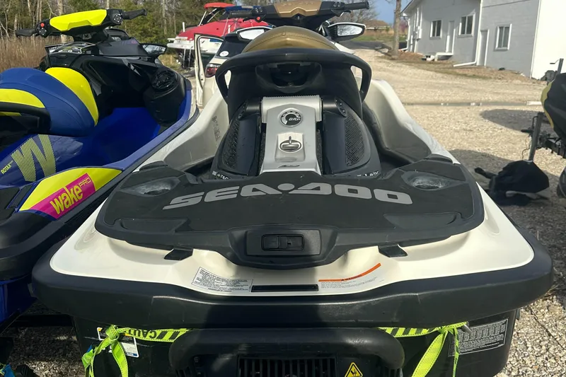 Slide: The Image of 2021 Sea-Doo Wake Pro 230 jet ski parked outdoors, rear view. - 22