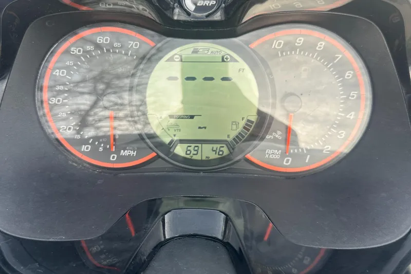 Slide: The Image of Dashboard of a 2021 Sea-Doo Wake Pro 230 showing speed and RPM gauges. - 28