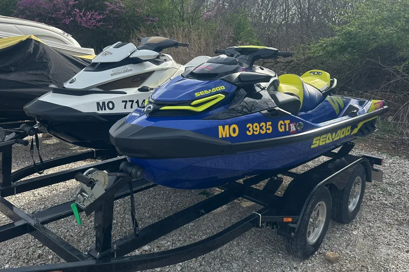 Slide: The Image of 2021 Sea-Doo Wake Pro 230 jet ski on trailer, parked outdoors. - 5