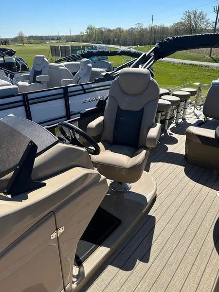 Slide: The Image of 2023 Starcraft CX25DL Bar pontoon boat with luxurious seating and modern helm. - 16