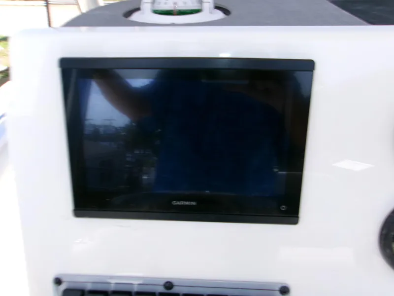 Slide: The Image of Dashboard of 2025 Key West 203 FS boat featuring a Garmin display. - 11