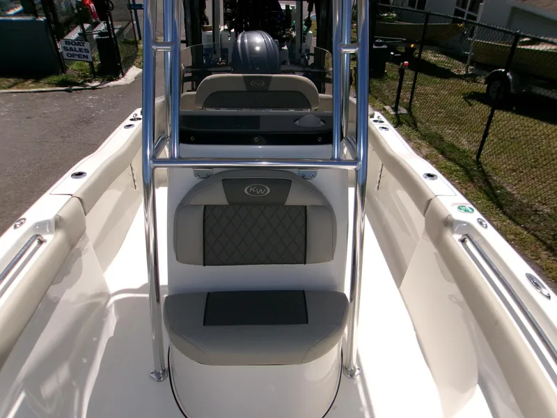 Slide: The Image of 2025 Key West 203 FS boat interior with seating and chrome railing. - 16