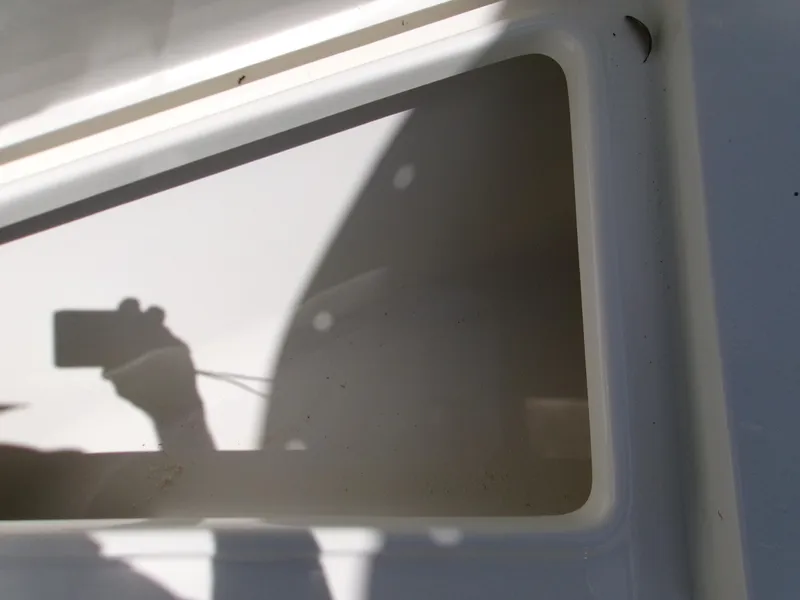 Slide: The Image of Reflection on Key West 203 FS boat surface, 2025 model. - 17