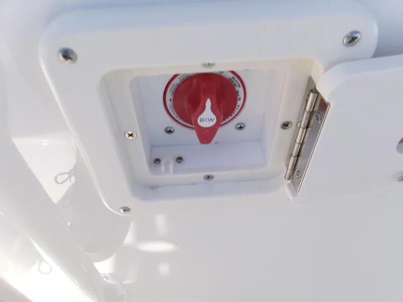 Slide: The Image of 2025 Key West 203 FS boat battery switch in white compartment. - 20