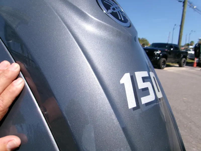 Slide: The Image of Close-up of a 2025 Key West 203 FS boat with "150" marking. - 8