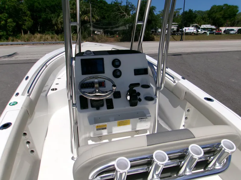 Slide: The Image of 2025 Key West 203 FS boat console with steering wheel and controls. - 9