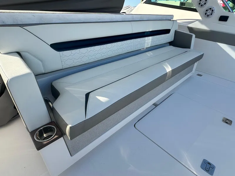 Slide: The Image of 2022 Tiara Yachts 43 LS interior seating with modern design and cup holder. - 15