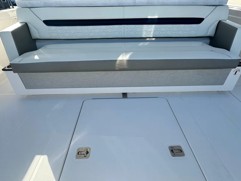 Slide: The Image of 2022 Tiara Yachts 43 LS interior seating with storage compartment. - 19
