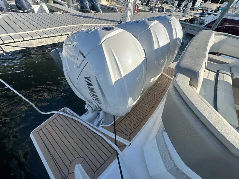 Slide: The Image of 2022 Tiara Yachts 43 LS with triple Yamaha outboard engines at dock. - 24