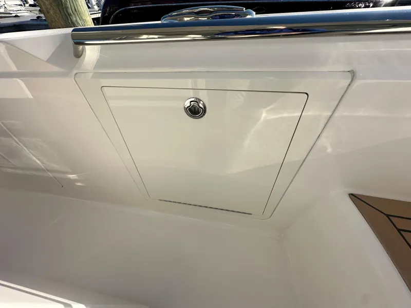 Slide: The Image of 2022 Tiara Yachts 43 LS, sleek storage compartment with stainless steel handle. - 31