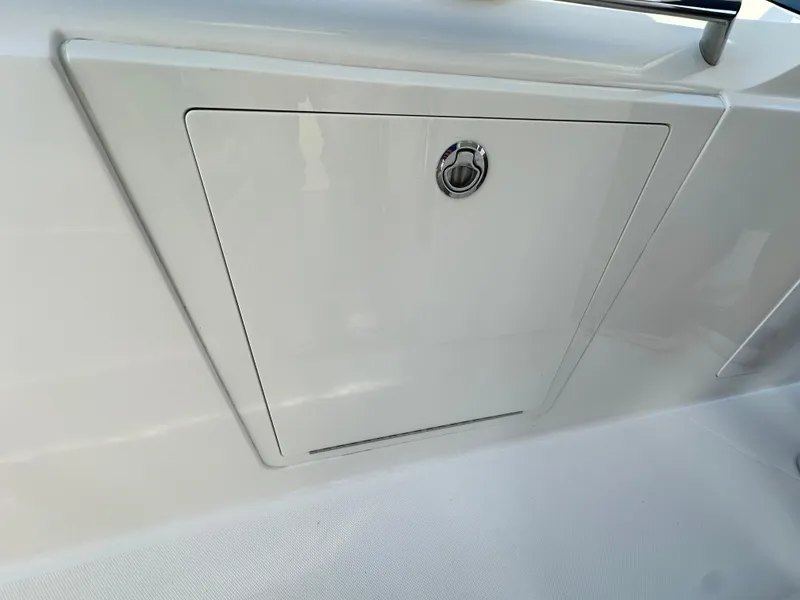 Slide: The Image of 2022 Tiara Yachts 43 LS storage compartment with sleek design and secure latch. - 32