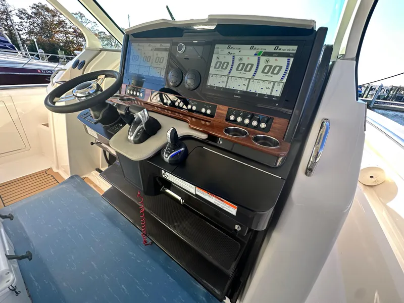 Slide: The Image of 2022 Tiara Yachts 43 LS helm with advanced navigation displays and controls. - 35