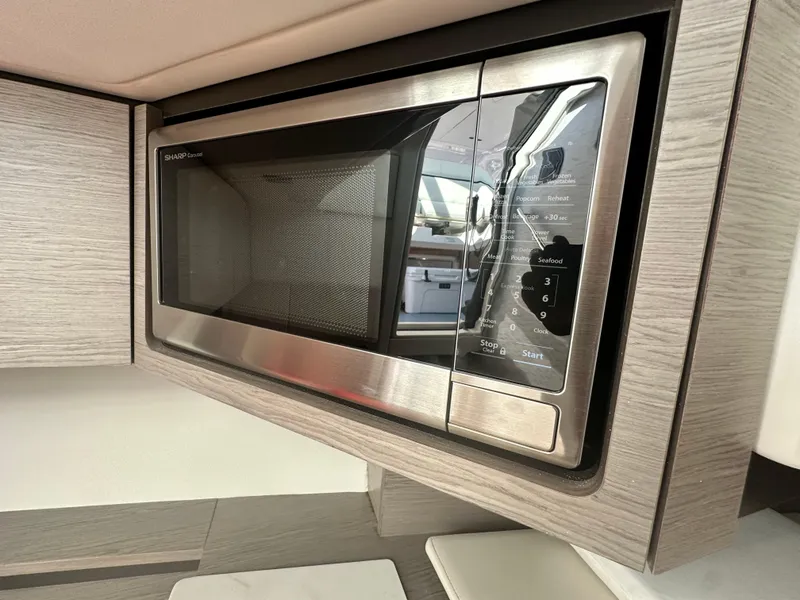 Slide: The Image of Built-in microwave in 2022 Tiara Yachts 43 LS, featuring sleek stainless steel design. - 48