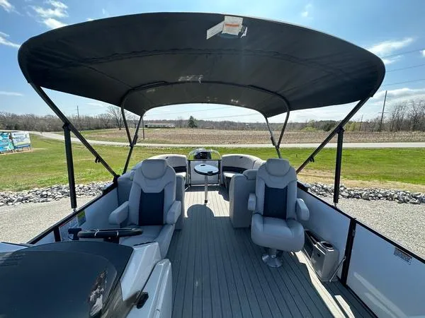 Slide: The Image of 2023 Starcraft SLS-3 pontoon boat with canopy, spacious seating, and modern design. - 6