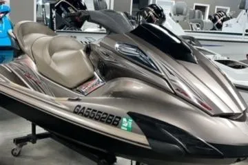 Slide: The Image of 2011 Yamaha WaveRunner FX Cruiser SHO in showroom, sleek design, beige color. - 1