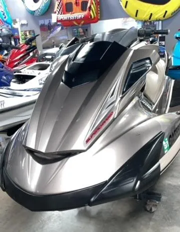 Slide: The Image of 2011 Yamaha WaveRunner FX Cruiser SHO in showroom, sleek design, metallic finish. - 2