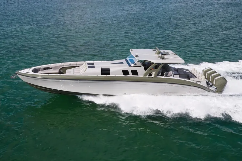 The Image of 2025 Midnight Express 52' Vitesse yacht cruising on clear blue water. - 0