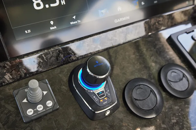 Slide: The Image of Control panel of 2025 Midnight Express 52' Vitesse with advanced navigation system. - 12