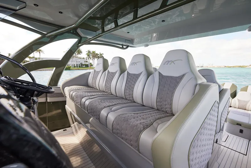 Slide: The Image of Luxurious interior seating of 2025 Midnight Express 52' Vitesse yacht, featuring elegant design. - 13