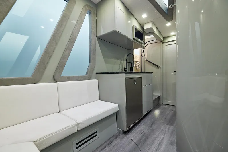 Slide: The Image of Modern interior of 2025 Midnight Express 52' Vitesse yacht with sleek kitchen and seating area. - 24
