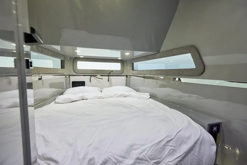 Slide: The Image of Luxurious cabin interior of 2025 Midnight Express 52' Vitesse yacht with cozy bedding. - 27