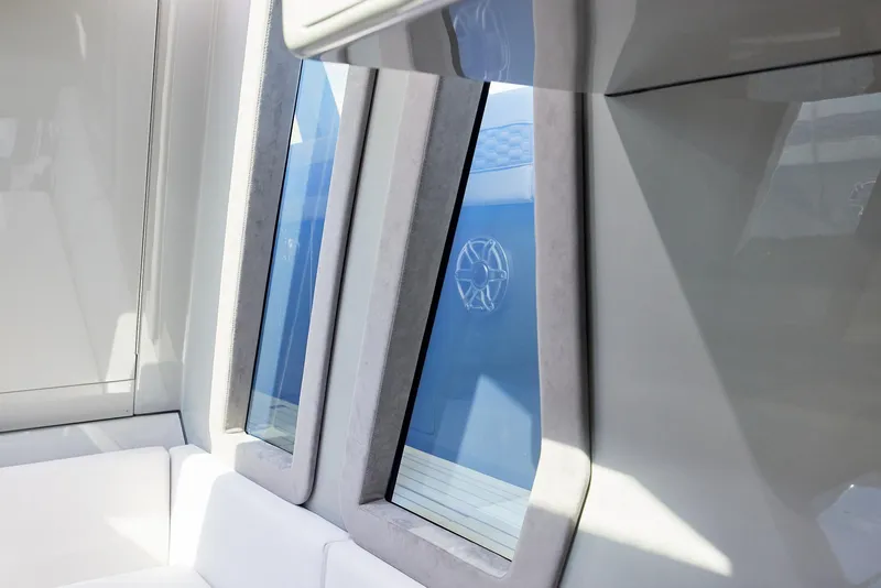 Slide: The Image of Interior view of 2025 Midnight Express 52' Vitesse yacht with modern windows and seating. - 29