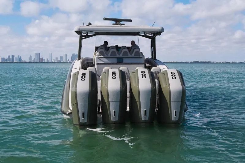 Slide: The Image of 2025 Midnight Express 52' Vitesse boat with five powerful engines on open water. - 5