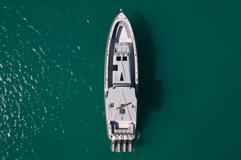 Slide: The Image of Aerial view of 2025 Midnight Express 52' Vitesse yacht on turquoise water. - 6