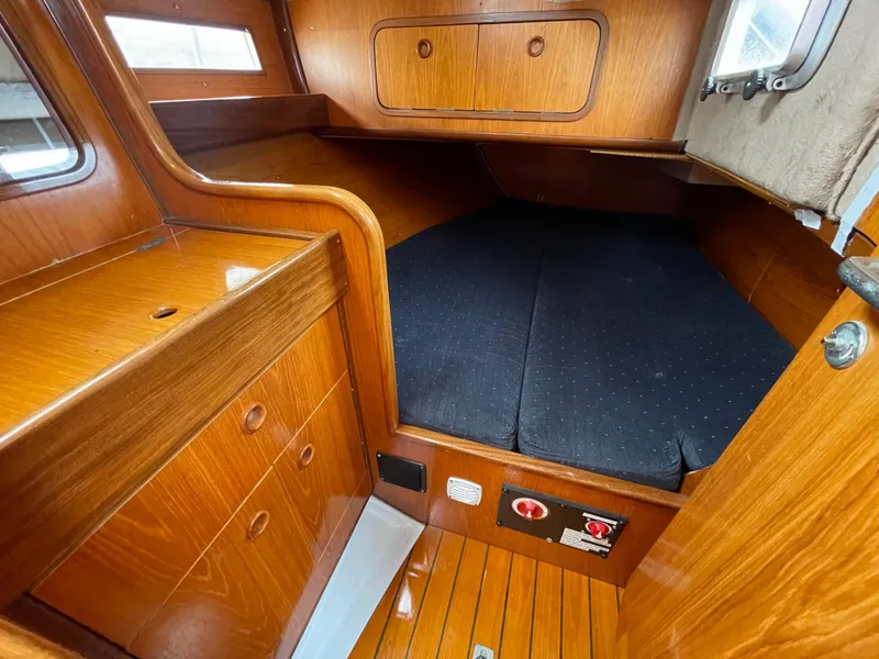 Slide: The Image of Cozy cabin interior of 1991 Beneteau Oceanis 390 sailboat with wooden finish. - 15