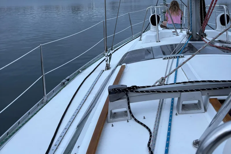 Slide: The Image of Sailing on a 1991 Beneteau Oceanis 390 yacht with a person on deck. - 2