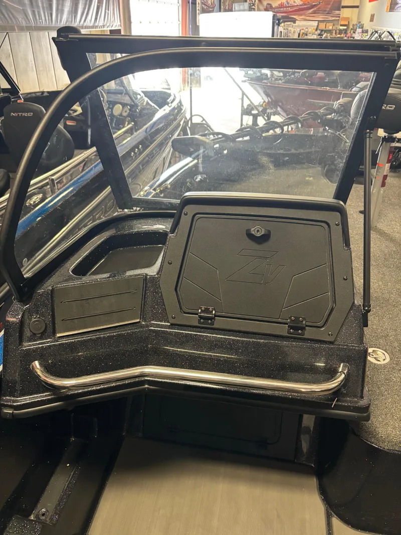 Slide: The Image of 2025 Nitro ZV21 Pro boat interior with sleek dashboard and storage compartment. - 12