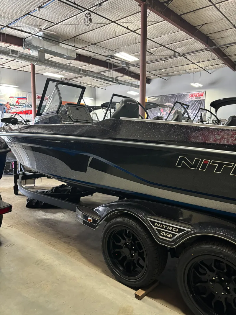 Slide: The Image of 2025 Nitro ZV21 Pro boat in showroom, featuring sleek design and modern features. - 2