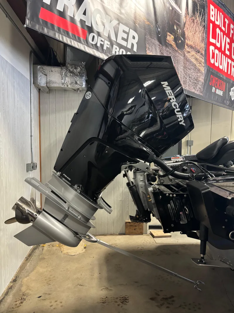 Slide: The Image of 2025 Nitro ZV21 Pro boat with Mercury outboard motor in showroom. - 3