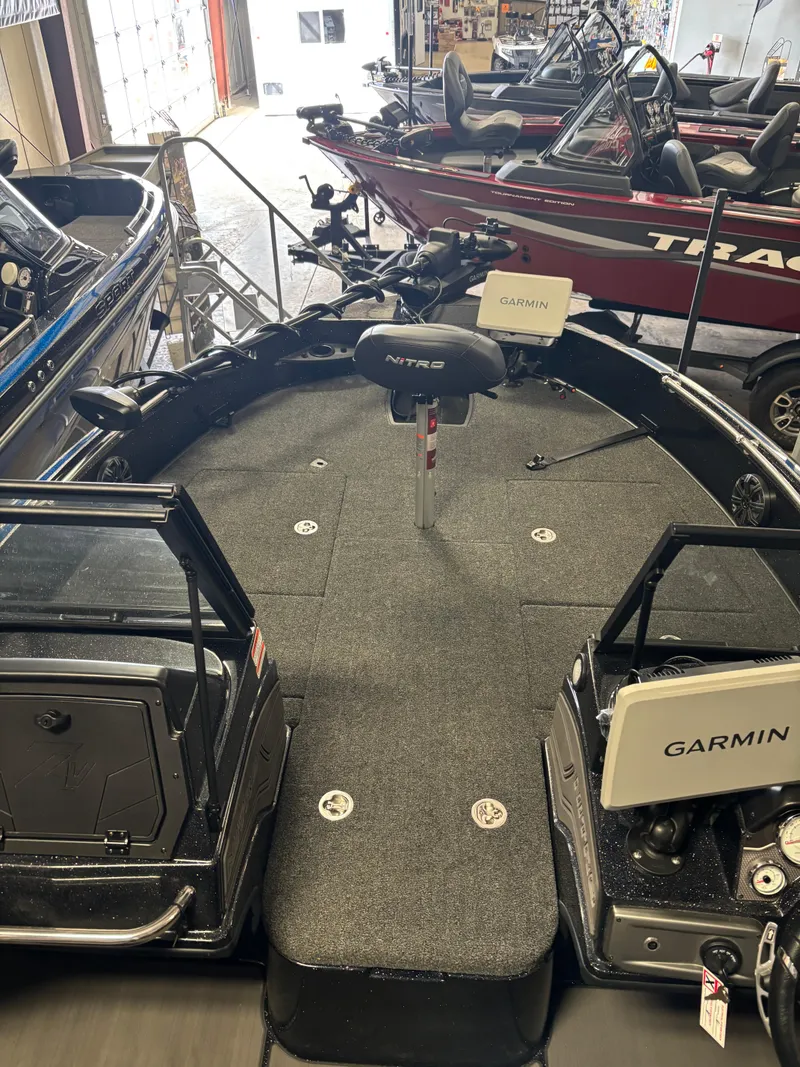 Slide: The Image of 2025 Nitro ZV21 Pro fishing boat with Garmin electronics in showroom. - 9