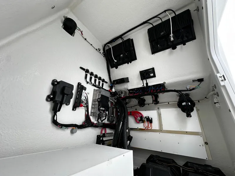 Slide: The Image of Electrical system setup inside a 2025 Pair Customs 27 model boat. - 19