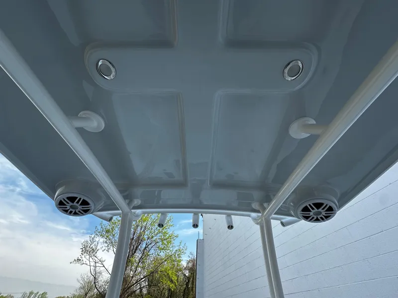 Slide: The Image of 2025 Pair Customs 27 boat canopy with integrated speakers and lights, viewed from below. - 21