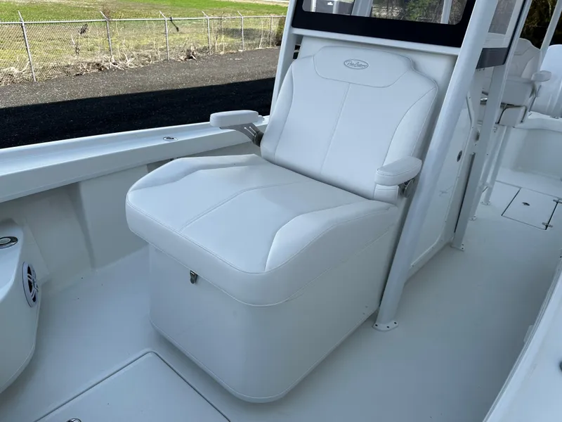 Slide: The Image of White seating on 2025 Pair Customs 27 boat, featuring sleek design and comfortable armrests. - 14