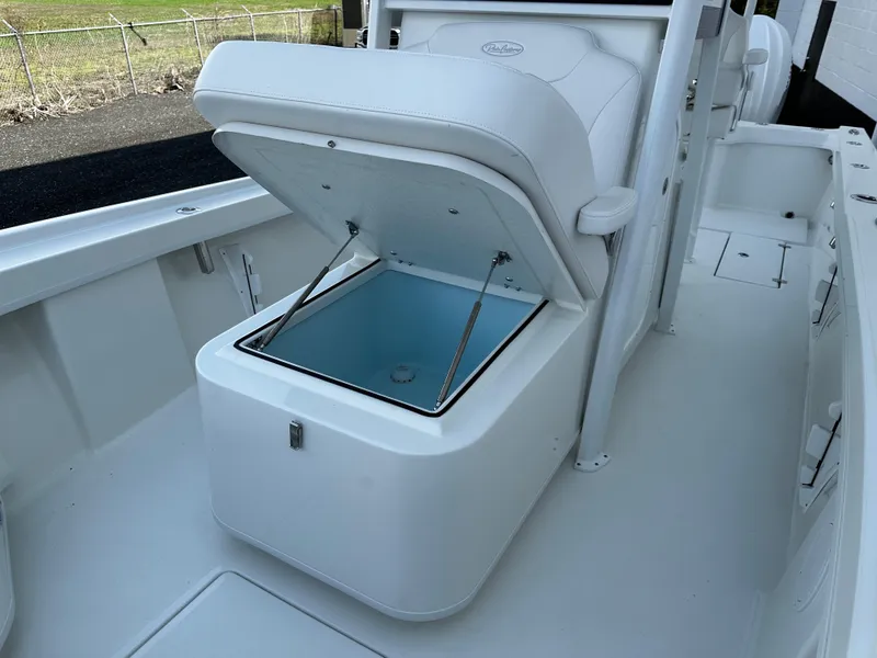 Slide: The Image of Open storage compartment on a 2025 Pair Customs 27 boat deck. - 15