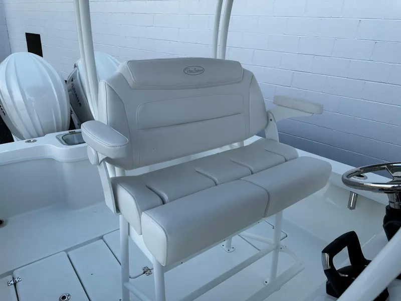 Slide: The Image of White seating on 2025 Pair Customs 27 boat, featuring dual engines and sleek design. - 9
