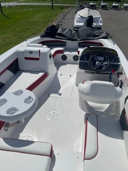 Slide: The Image of 2022 Hurricane SS 192 RL OB boat interior with seating, steering wheel, and cup holders. - 3