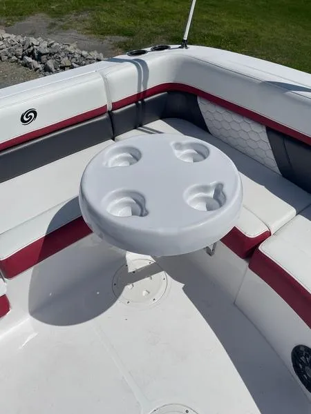 Slide: The Image of 2022 Hurricane SS 192 RL OB boat interior with round table and seating. - 9