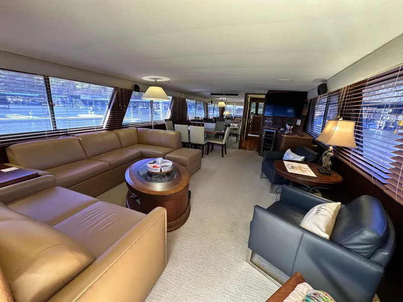 Slide: The Image of Luxurious interior of 1987 Hatteras 63 Motor Yacht with elegant seating and decor. - 19